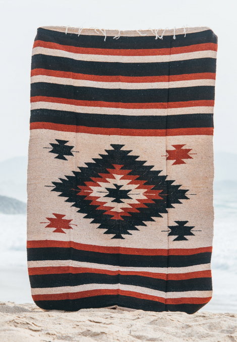 Mexican blanket or beach rug in brown tones and tribal patterns