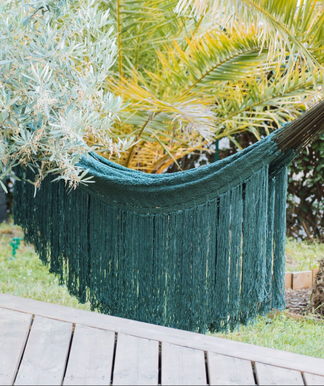 Olive green hammock in garden