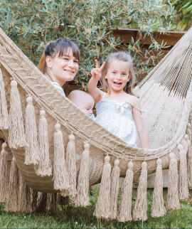 Beige family hammock with hanging tassels
