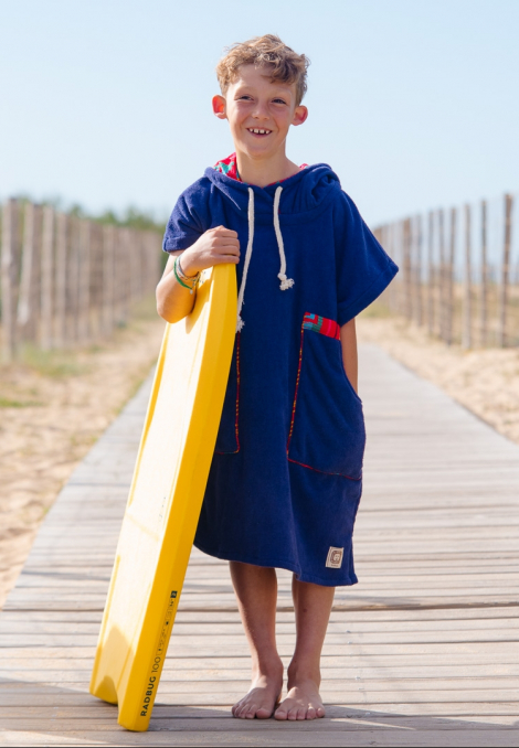 boy with blue kids surf poncho